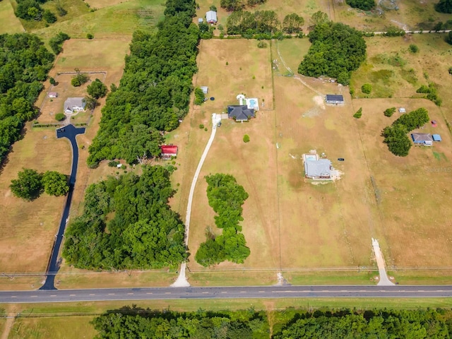 birds eye view of property featuring a rural view