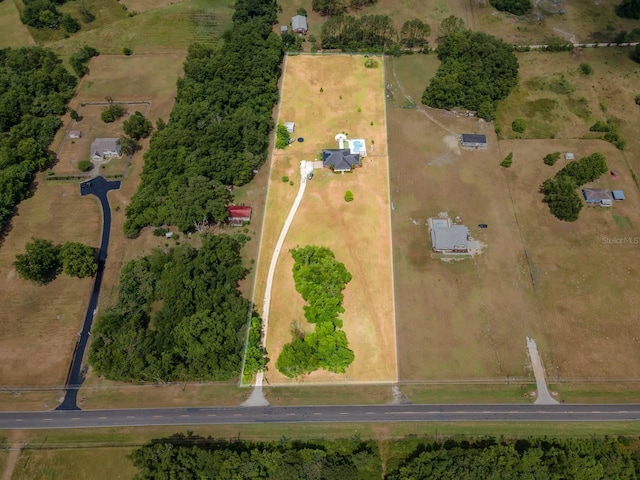 birds eye view of property with a rural view