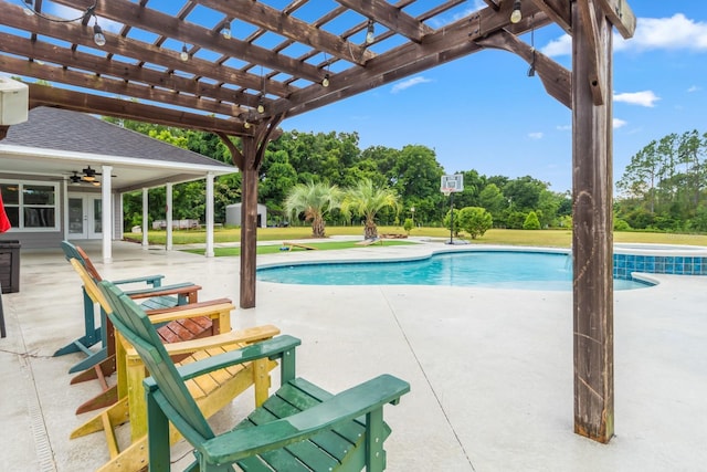 view of pool with a pergola, ceiling fan, and a patio area