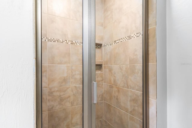 bathroom with a shower with shower door