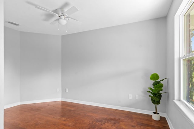 spare room with hardwood / wood-style flooring and ceiling fan