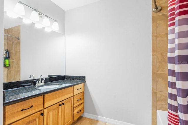 bathroom with tile patterned flooring, vanity, and shower / bath combination with curtain