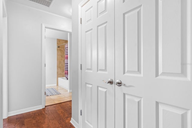 hall with dark hardwood / wood-style flooring