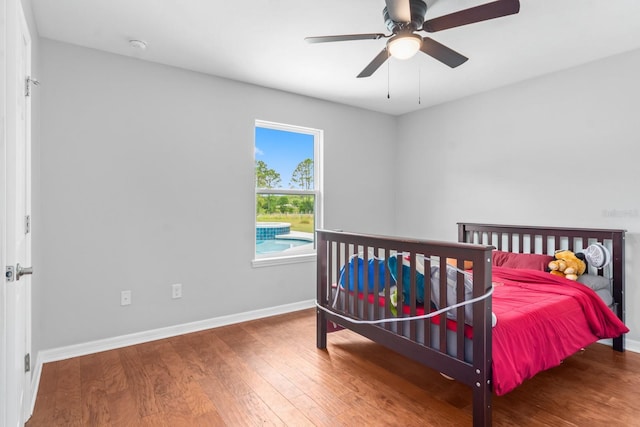 bedroom with ceiling fan and wood-type flooring