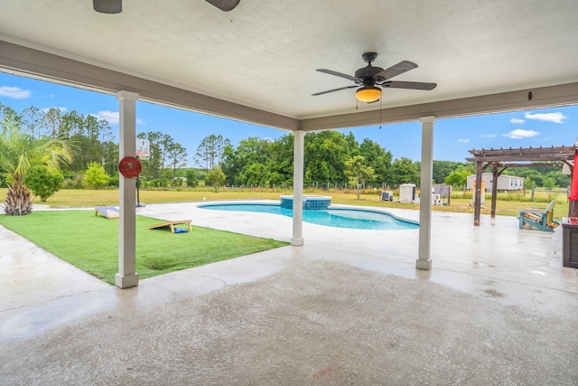 view of swimming pool featuring a patio, a pergola, an in ground hot tub, and a yard