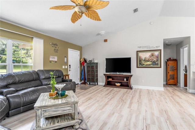 living area with visible vents, baseboards, a ceiling fan, lofted ceiling, and light wood-type flooring