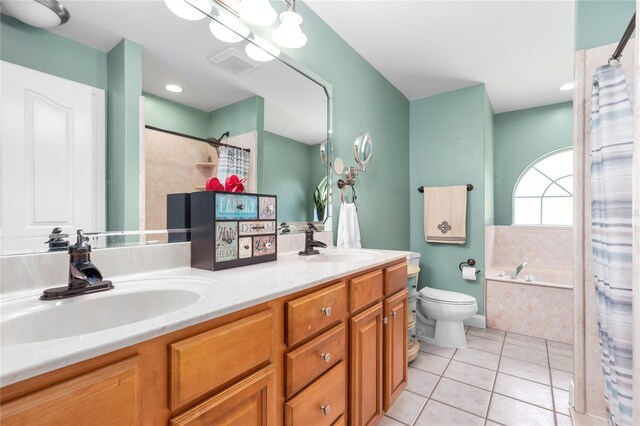 full bath with a bath, double vanity, toilet, a sink, and tile patterned flooring
