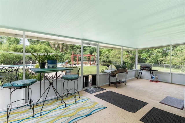 sunroom / solarium featuring outdoor dry bar