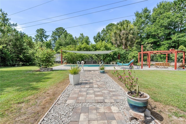 view of yard with a patio, a pergola, and an outdoor pool