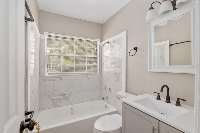 full bathroom featuring vanity, toilet, and tiled shower / bath