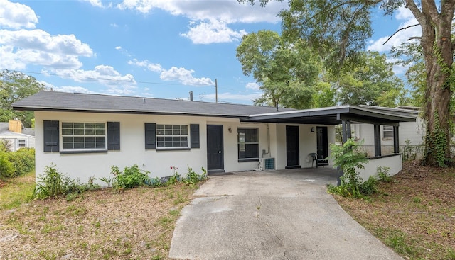 single story home featuring a carport