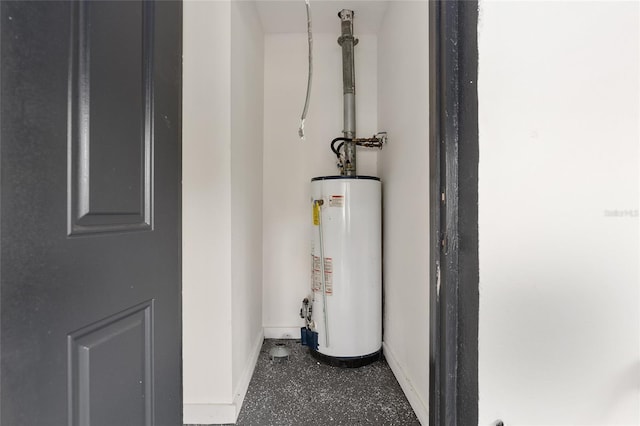 utility room featuring water heater