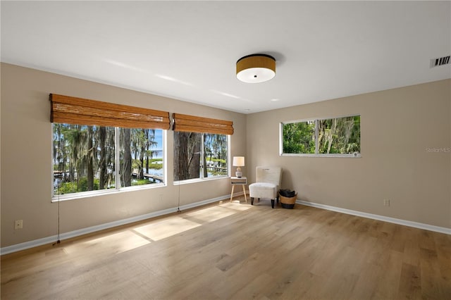 unfurnished room featuring light hardwood / wood-style flooring