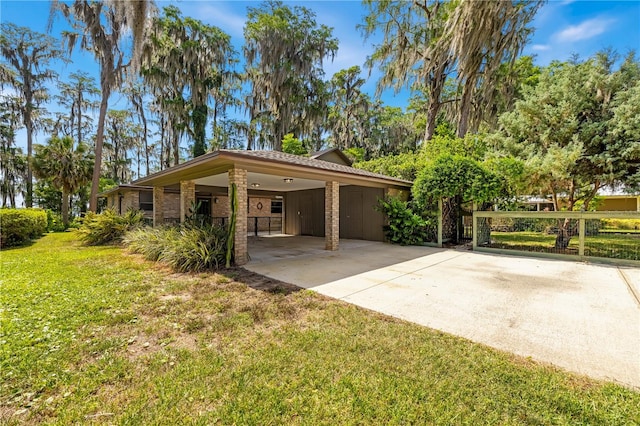 exterior space featuring a lawn and a carport