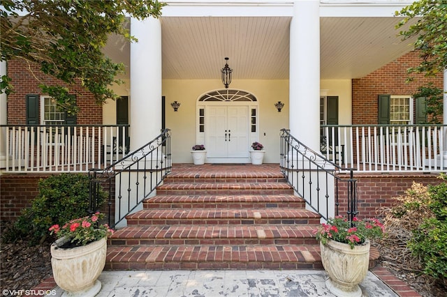 property entrance with covered porch