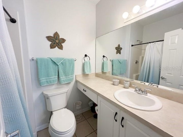 bathroom featuring tile patterned flooring, vanity, a shower with curtain, and toilet