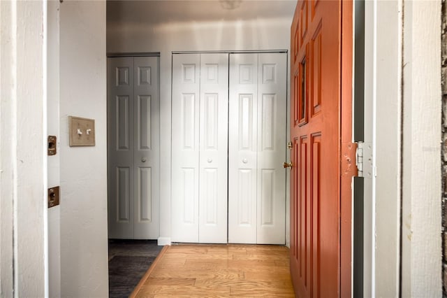 hall with light hardwood / wood-style flooring