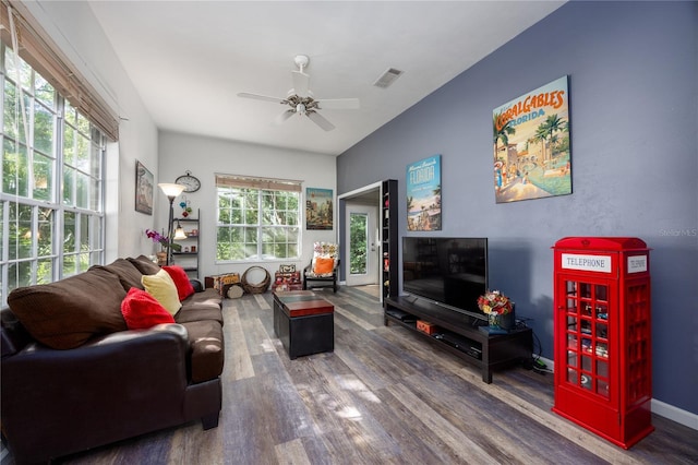 living room with dark hardwood / wood-style floors and ceiling fan