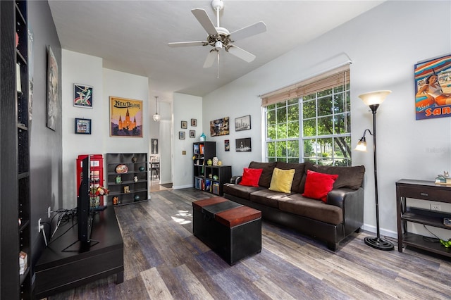 living room featuring dark hardwood / wood-style floors and ceiling fan