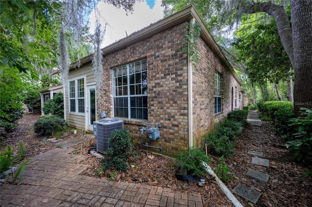 view of home's exterior with central AC unit