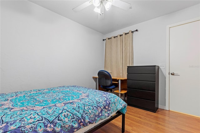 bedroom with hardwood / wood-style flooring and ceiling fan