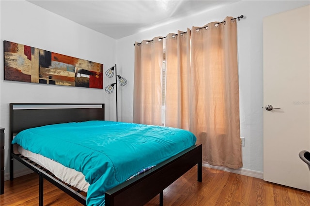 bedroom featuring hardwood / wood-style flooring