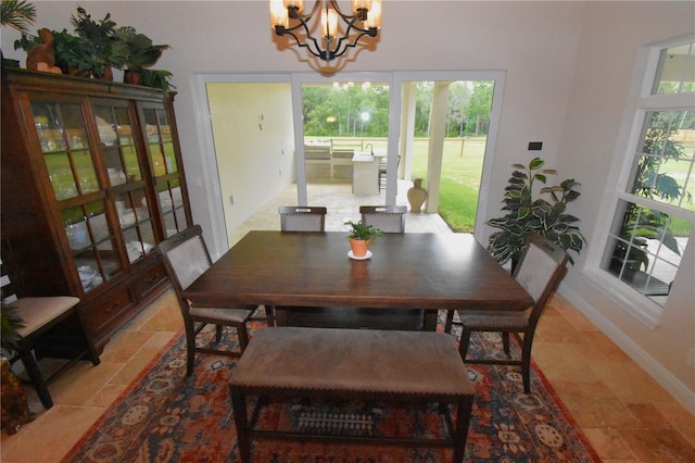 dining room with plenty of natural light and a chandelier