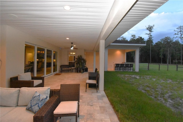 view of patio featuring ceiling fan and an outdoor hangout area