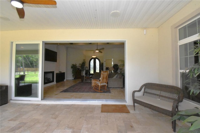 view of patio featuring ceiling fan