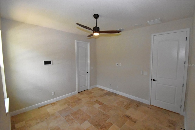 empty room featuring ceiling fan