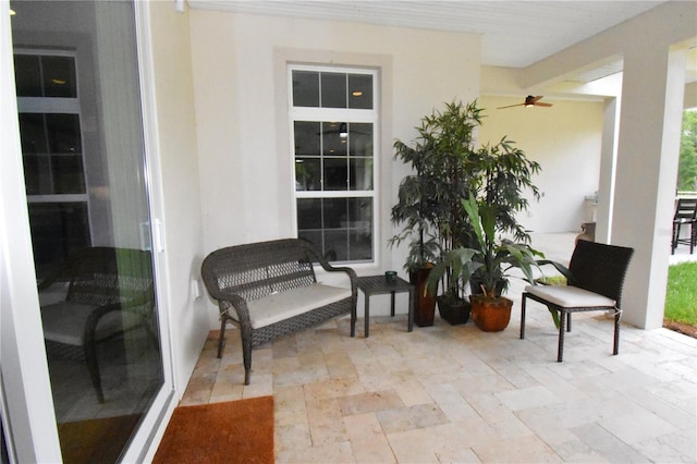 view of patio featuring ceiling fan