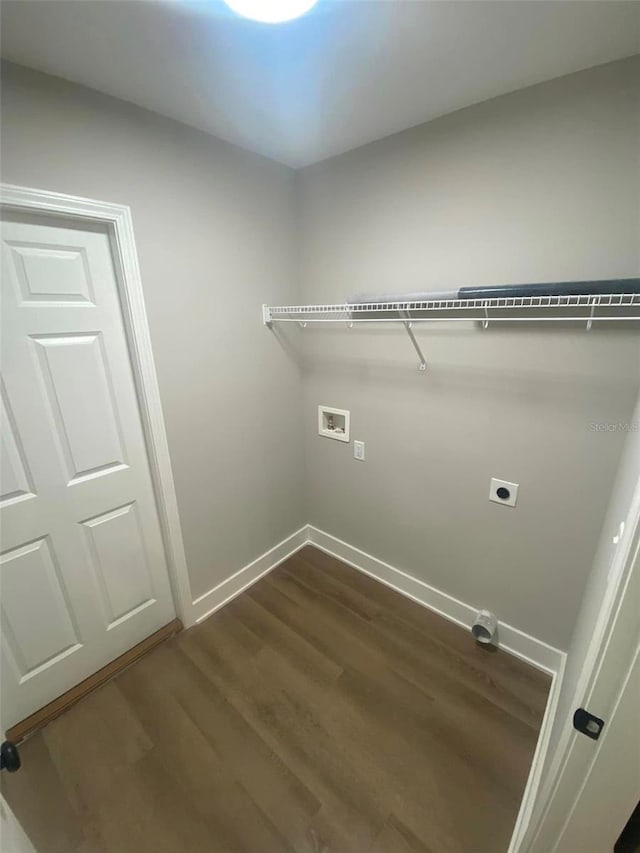 clothes washing area featuring washer hookup, dark hardwood / wood-style floors, and electric dryer hookup