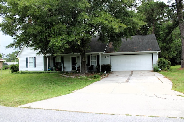 view of front of property featuring a garage and a front yard