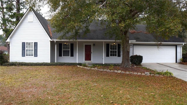 view of front of house featuring a garage and a front lawn