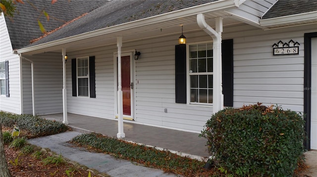 doorway to property with covered porch