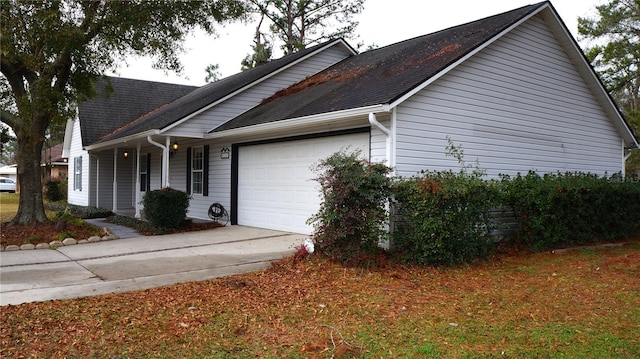 view of side of property with a garage