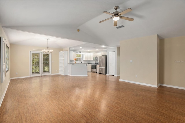 unfurnished living room featuring hardwood / wood-style floors, ceiling fan with notable chandelier, and lofted ceiling