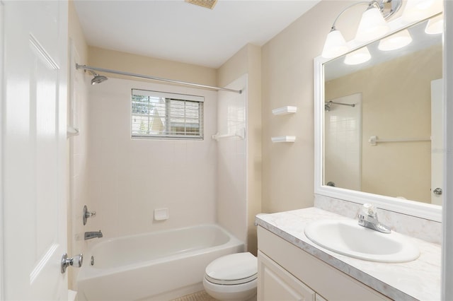 full bathroom with vanity, toilet, and tiled shower / bath