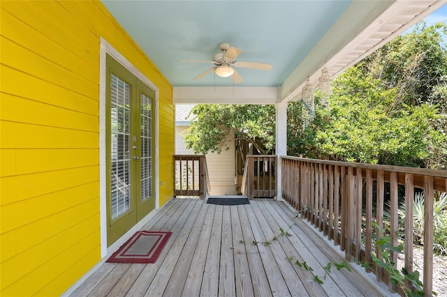 wooden deck featuring ceiling fan and french doors