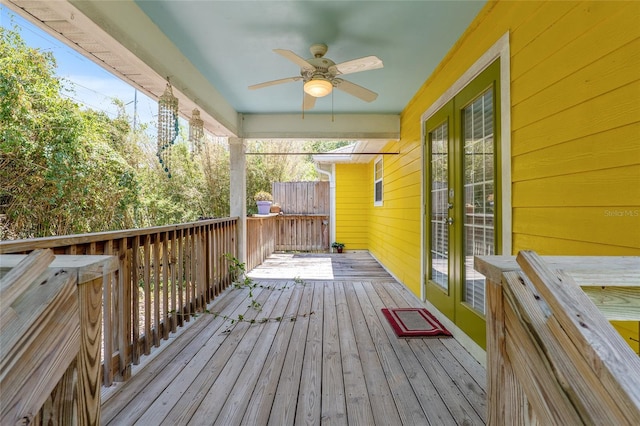 wooden terrace featuring ceiling fan