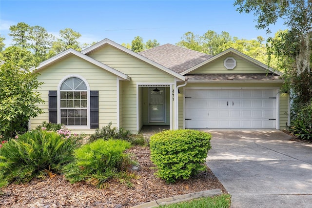 ranch-style home featuring a garage