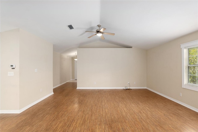 empty room with light wood-type flooring, ceiling fan, and lofted ceiling