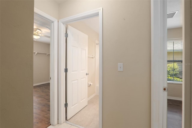 hallway with light tile patterned floors