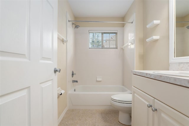 full bathroom with tile patterned flooring, vanity, toilet, and tiled shower / bath