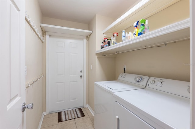 laundry room with light tile patterned floors and separate washer and dryer