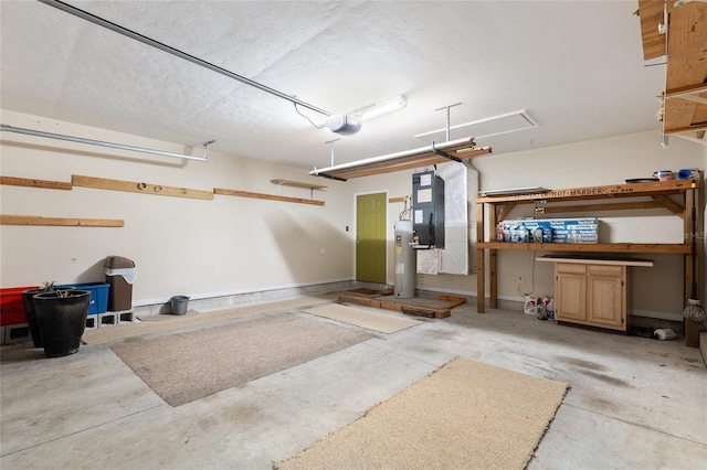 garage with water heater and a garage door opener