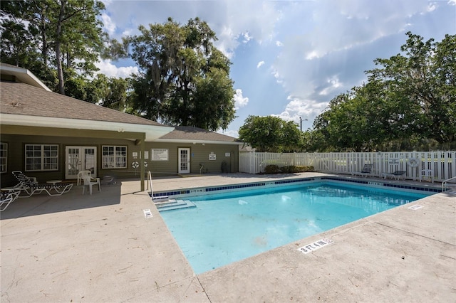 view of pool featuring a patio and french doors