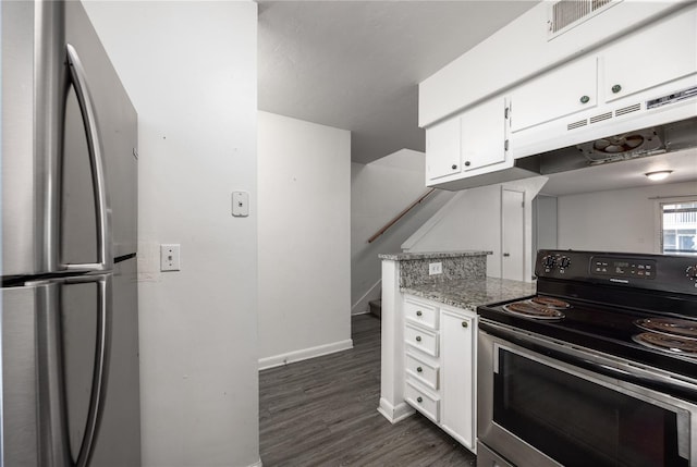 kitchen featuring appliances with stainless steel finishes, white cabinetry, dark hardwood / wood-style floors, and light stone counters