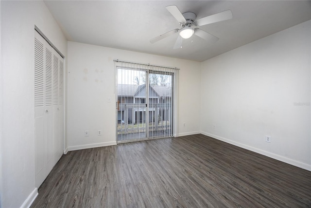 unfurnished bedroom with ceiling fan, a closet, dark wood-type flooring, and access to outside