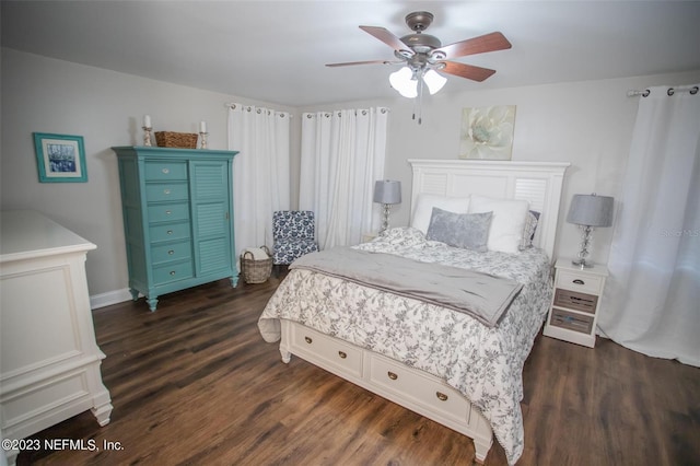 bedroom with ceiling fan and dark hardwood / wood-style flooring